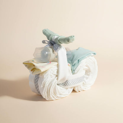 Blå blemotorcykel med søde detaljer som gave til babyshower for dreng