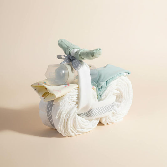 Blå blemotorcykel med søde detaljer som gave til babyshower for dreng