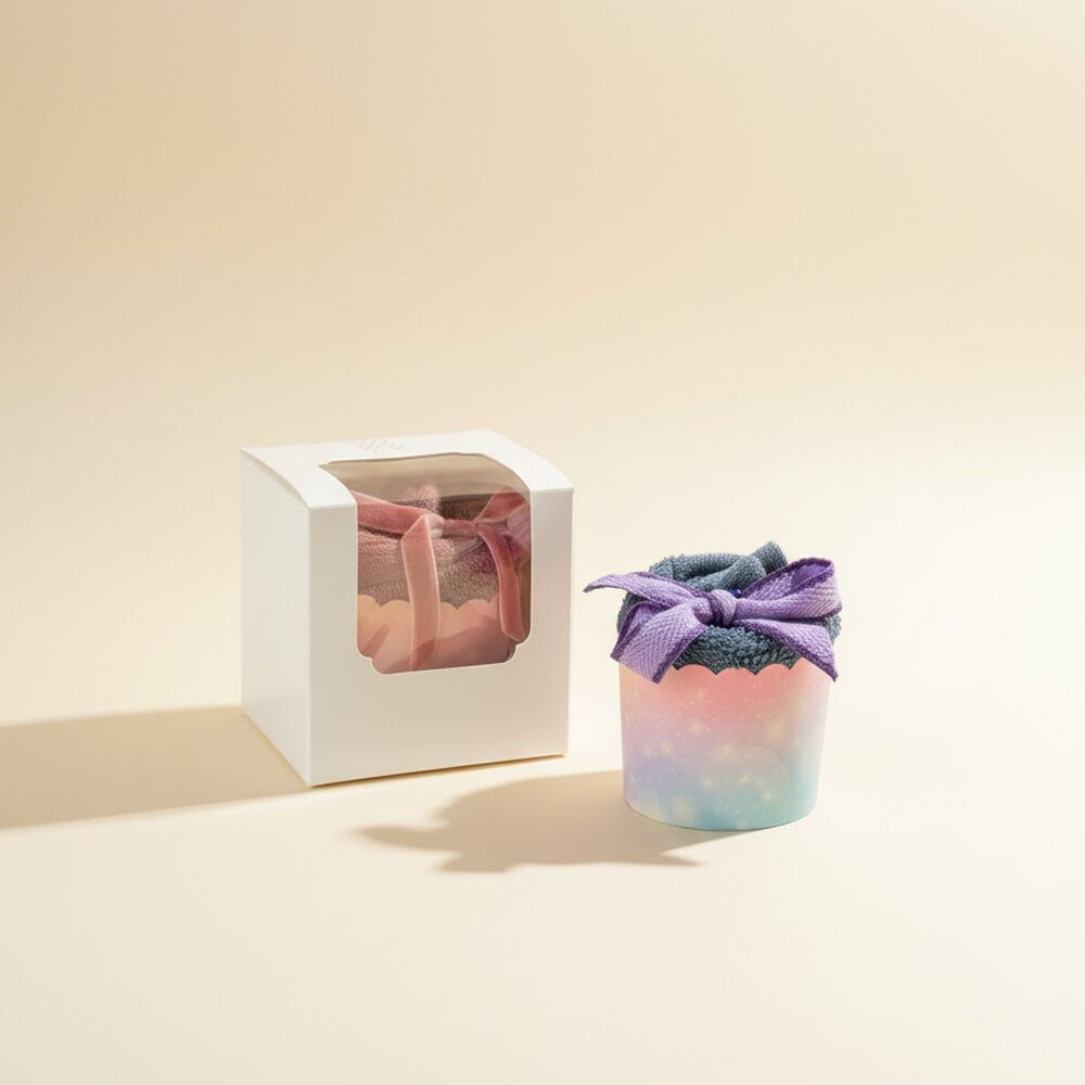 Håndklæde cupcakes i blå og lyserød farve som søde babyshowergaver