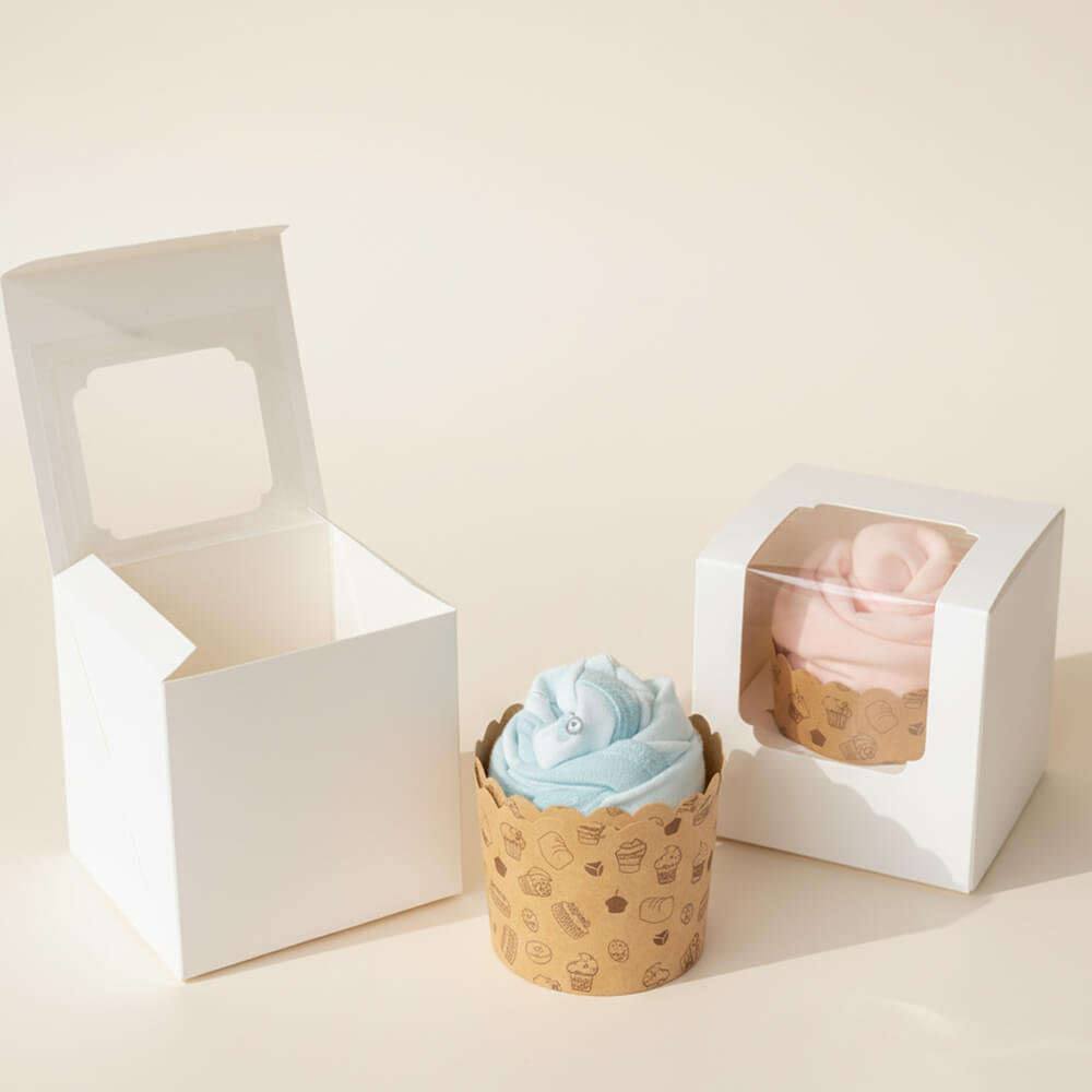 Cupcakes lavet af babybody i blå og lyserød farve som små kreative gaver