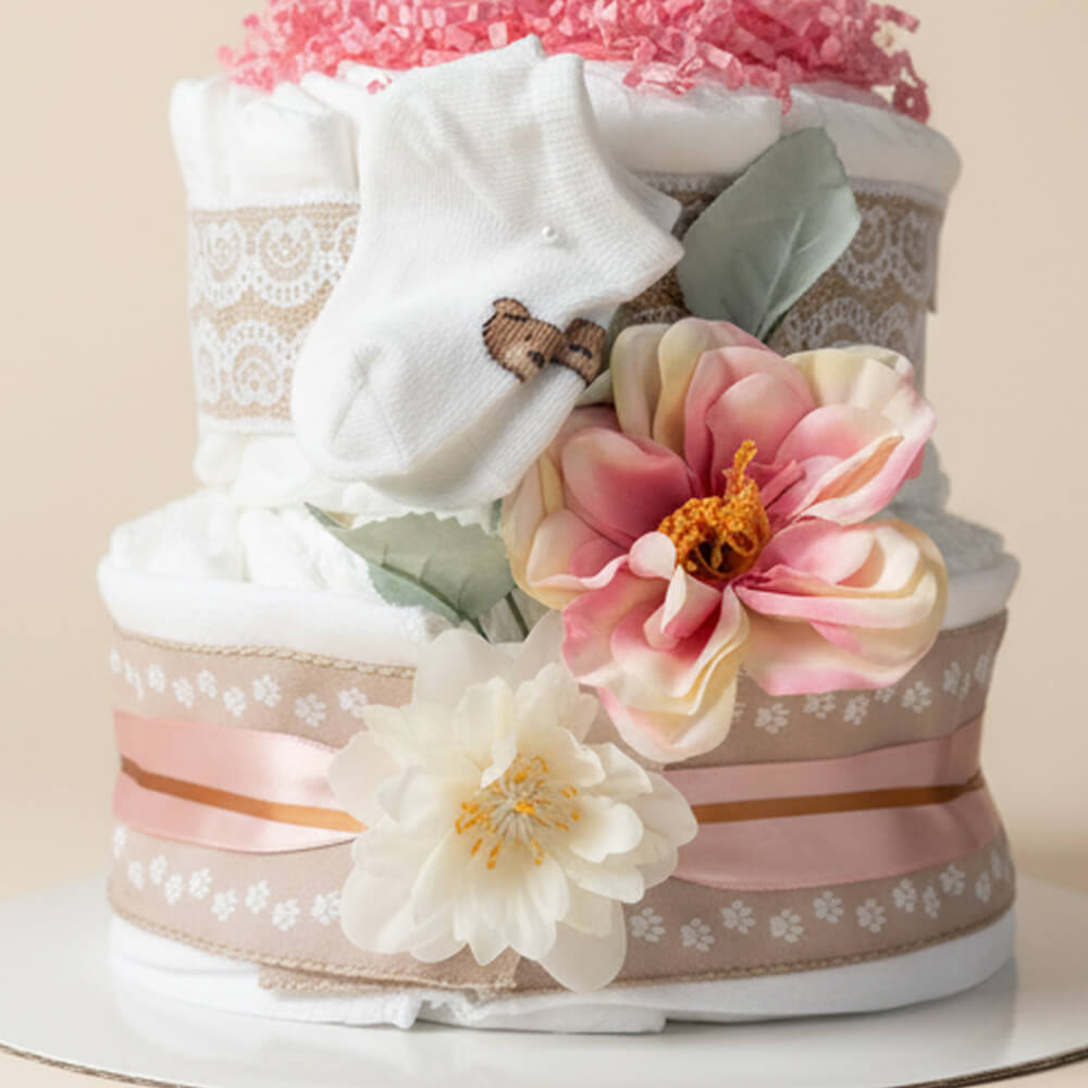 Mellem blekage i lyserøde og røde nuancer som gave til pige babyshower